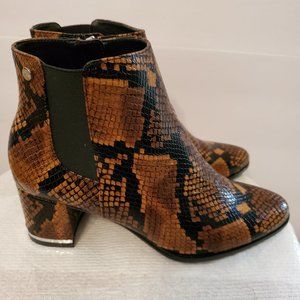 Calvin Klein Ankle length booties feature a trendy animal print design Size 6.5